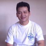 The future monk, wiht a white tee-shirt and his black hairs