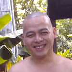 The future monk is smiling, his skull is smooth