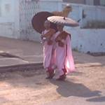 Two nuns under their umbrellas