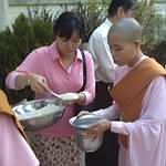 Nun receiving rice