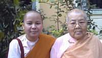 The nun Nanda Mālā, standing beside the elder nun of the convent wher she lived a couple of years. Young nun with old nun